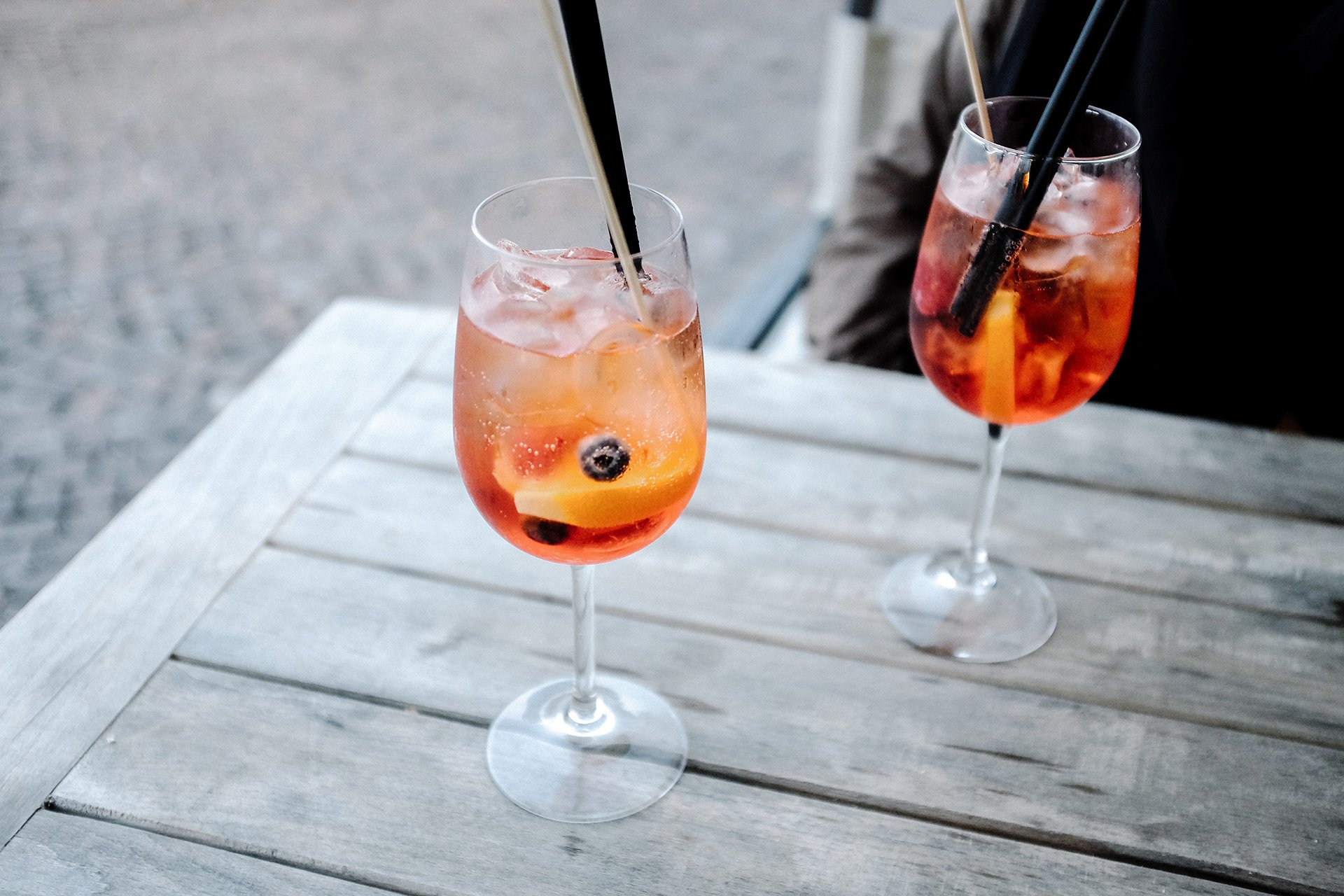 Two spritz cocktails on a table