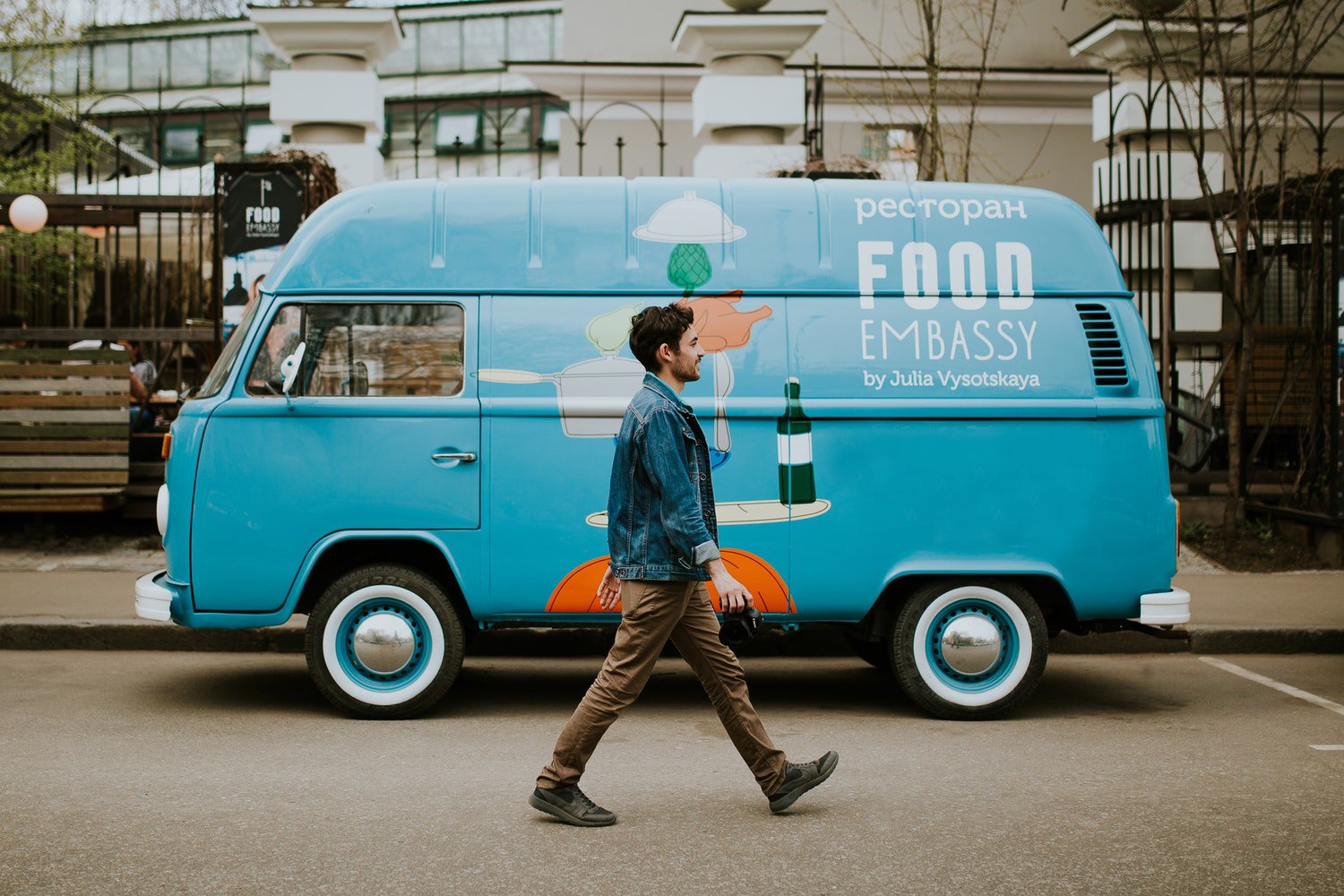Man walking past a food truck van